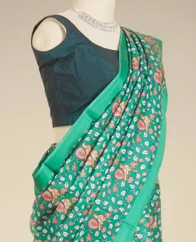 Green kalamkari-style floral vine & peacock printed silk saree, paisley motifs border
