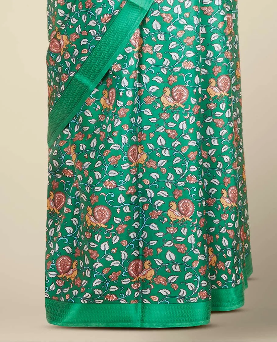 Green kalamkari-style floral vine & peacock printed silk saree, paisley motifs border